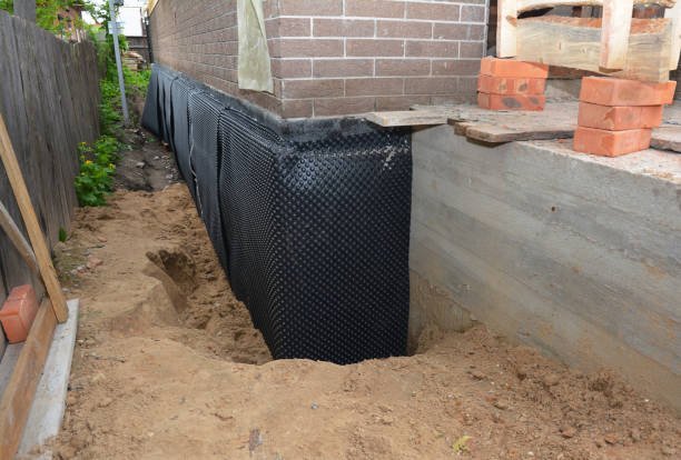 Happy homeowners after waterproofing job in Savage